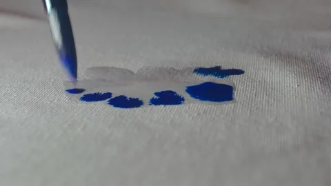 Macro Extreme Close Up of Blue Paint Bleeding into Water on Canvas Stock Footage 327515119
