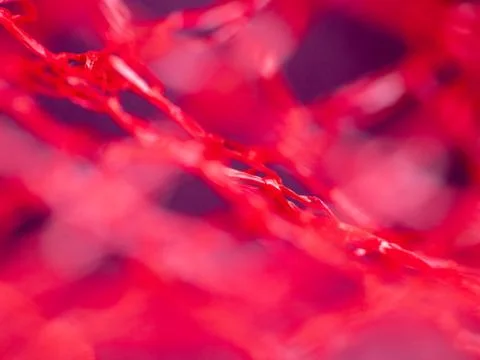 Macro extreme close-up of red material Stock Photos
