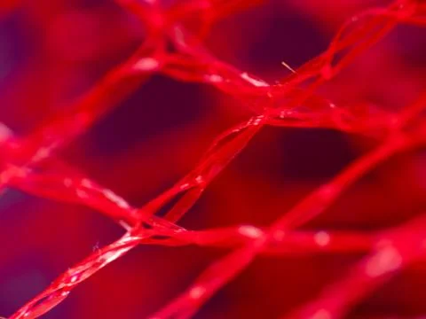 Macro extreme close-up of red material Stock Photos