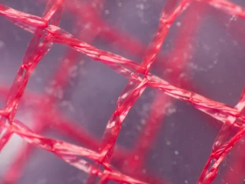 Macro extreme close-up of red material Stock Photos