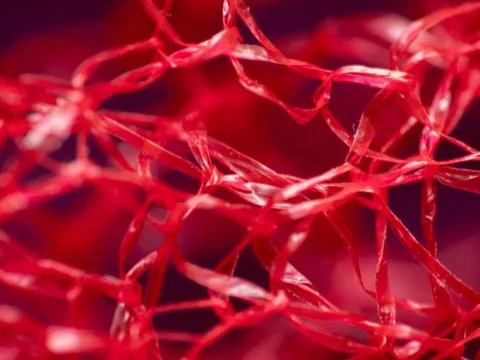 Macro extreme close-up of red material Stock Photos