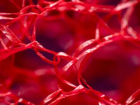 Macro extreme close-up of red material Stock Photos
