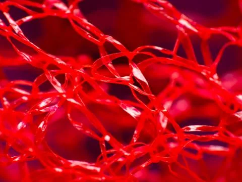 Macro extreme close-up of red material Stock Photos
