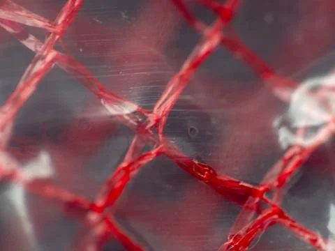 Macro extreme close-up of red material Stock Photos