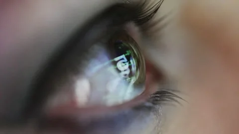 Macro of eye with reflected code and data Stock Footage 321648393