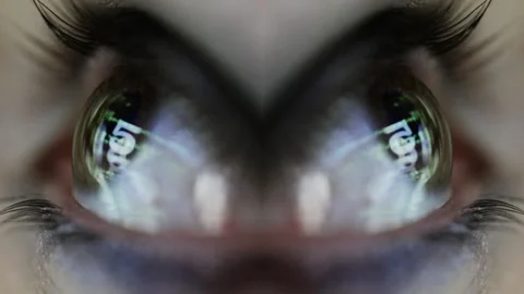 Macro of eye with reflected code and data Stock Footage 321648443