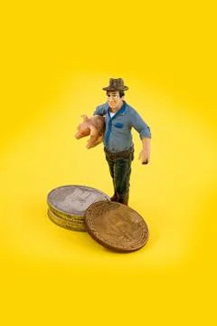 Macro farmer figures mining of bitcoins. Virtual cryptocurrency mining concep Stock Photos