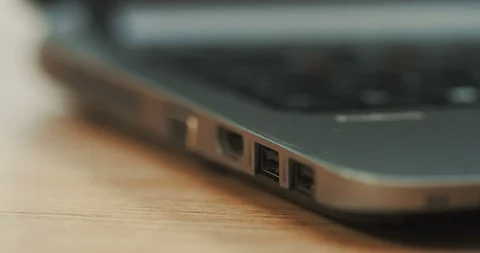Macro of the female hand putting the flash card in the black laptop computer Stock Footage 86434726