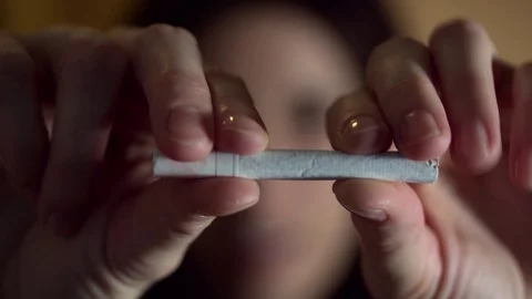 Macro female hands break cigarette. Stock Footage 69944905