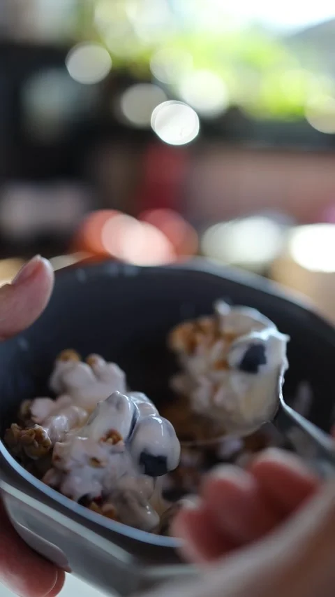 Macro female hands mix a fruit breakfast Stock Footage 246443347