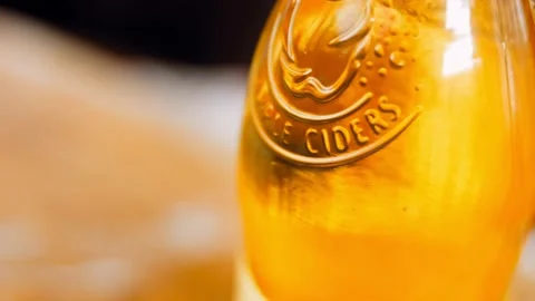 Macro filmed apple cider bottle Stock Footage 196900459