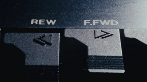 Macro of Finger Pressing Rewind Button on Retro Black Audio Deck Stock Footage 342452518