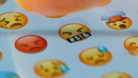 Macro finger scrolling emojis on a virtual keyboard Stock Footage 129080831