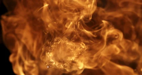 Macro of fire burning with bright orange flames on dark background at 1000 fps Stock Footage 268412763