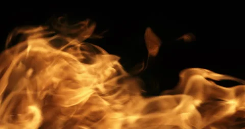Macro of fire burning with bright orange flames on dark background at 1000 fps Stock Footage 268414645