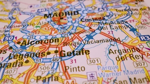 Macro flight to madrid, spain, across detailed road atlas map Stock Footage 341269400