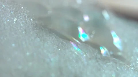 Macro focus sweep through shimmering soap foam and bubbles Stock Footage 312593112