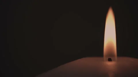 Macro footage of a candle burning in the dark 動画素材 197015986