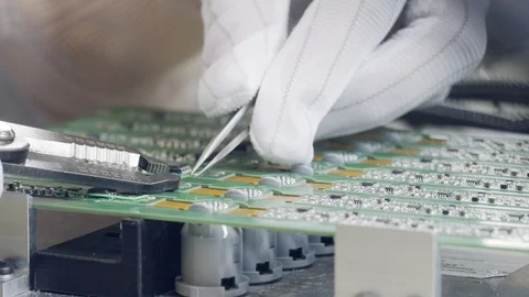 Macro footage of manual welding process in an electronics factory Stock Footage 100468288