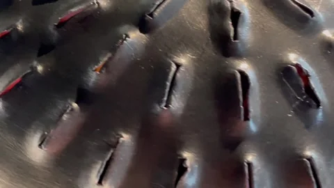 Macro footage of a perforated metal surface showing industrial texture and patte Video stock 326439057