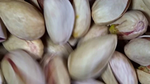 Macro footage rotating and stirring pistachio nuts Stock Footage 159341069