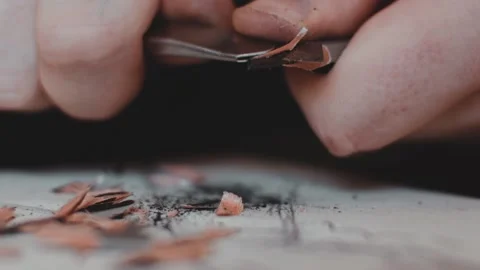 Macro footage of sharpening graphite pencil process using a blade of hobby knife Stock Footage 162497220