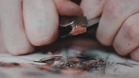 Macro footage of sharpening graphite pencil process using a blade of hobby knife Stock Footage 162500974