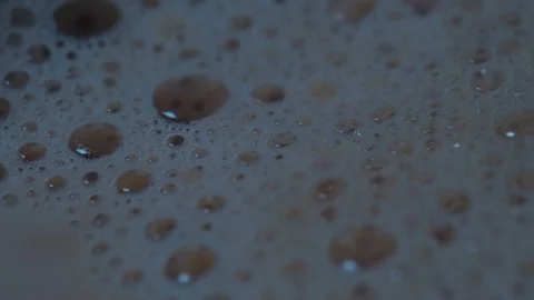 Macro footage of a surface of the coffee with bubbles boilling in the cup Stock-Footage 161028333