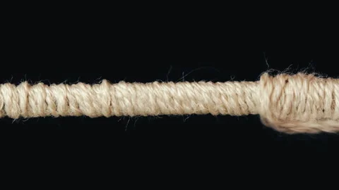 Macro Footage of Thick Thread Winding onto Metal Wire Stock Footage 251190794