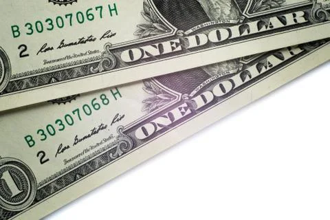Macro. Fragment of two one-dollar US bills with a portrait of Washington. Num Stock Photos