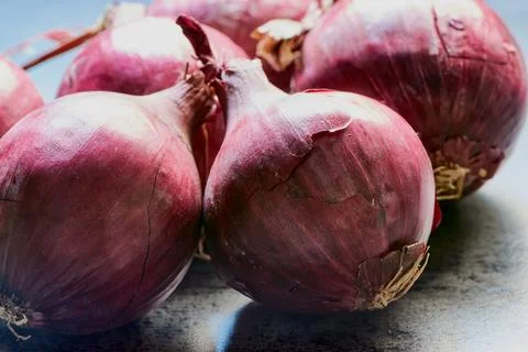 Macro of fresh red onions Стоковые фото
