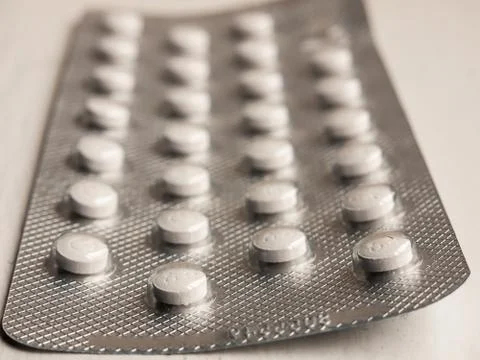 Macro of full packet foil of white tablets healthcare Stock Photos