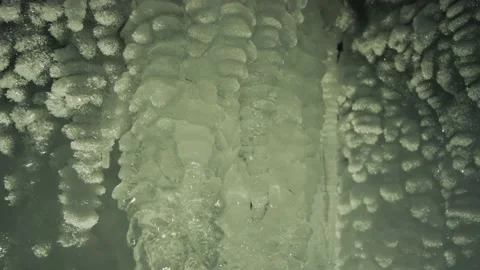 Macro glittering ice floes splashes of frozen winter icicles night cave Arctic Stock Footage 165664196