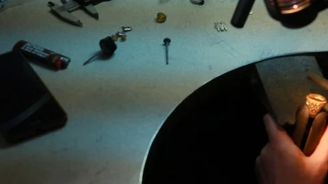 Macro of a goldsmith cutting and filing the steel to make a ring. Concept Stock Footage 120003973