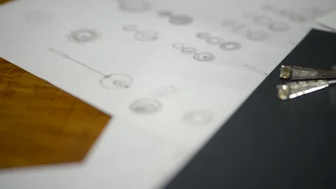 Macro of a goldsmith cutting and filing the steel to make a ring. Concept Stock Footage 120004117