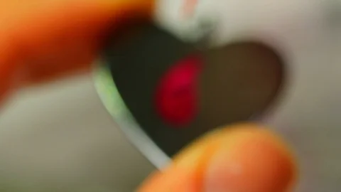 Macro of a goldsmith cutting and filing the steel to make a ring. Concept Stock Footage 120006732