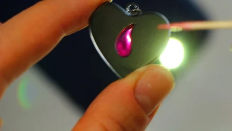 Macro of a goldsmith cutting and filing the steel to make a ring. Concept Stock Footage 120006772
