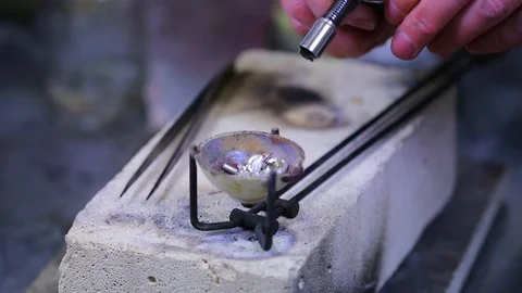 Macro of a goldsmith cutting and filing the steel to make a ring. Concept Stock Footage 120006972