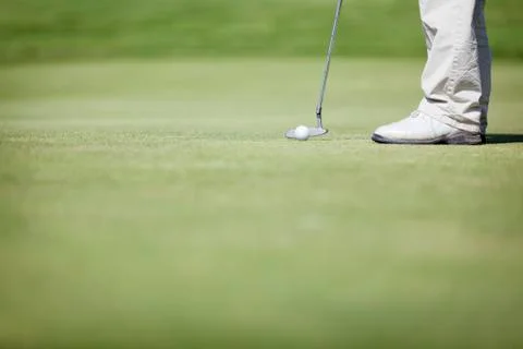 Macro of golf player putting. Foto stock