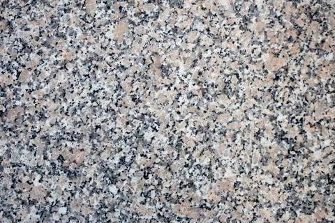 Macro of granite stone background. Black, gray and white colored granite texture Stock Photos