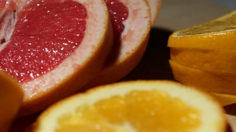 Macro grapefruit and lemon sliced on a bamboo board Stock Footage 146147244