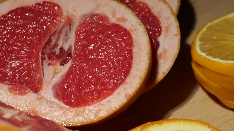 Macro grapefruit and lemon sliced on a bamboo board Stock Footage 146148037