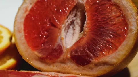 Macro grapefruit, oranges, lemon and pineapple sliced on a bamboo board Stock Footage 146146418