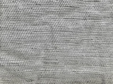Macro gray linen fabric texture reveals detailed woven pattern in minimalist  库存照片