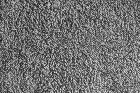 Macro of gray microfiber bath towel, soft fluffy fabric, absorbent material.. Stock Photos