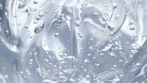 Macro grey transparent cosmetic serum gel, cream, fluid texture with air bubbles Stock Footage 176186051