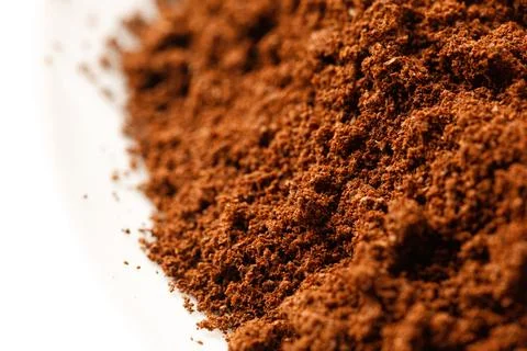 Macro Ground coffee. Texture of coffee, close up on white background Stock Photos