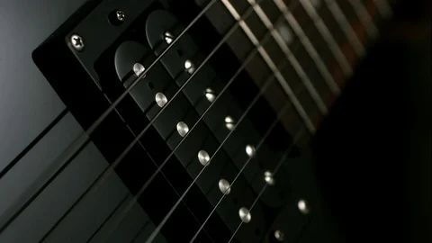 Macro Guitar String Vibrates in Slow Motion Stock Footage 70370222