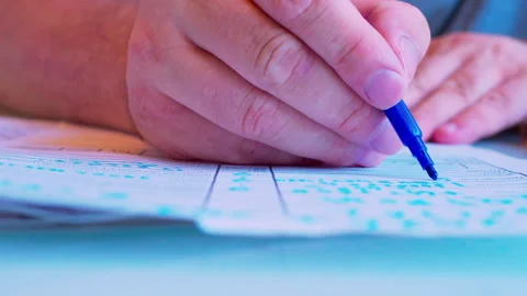 Macro of a hand filling a survey or job application form Stock Footage 336691788