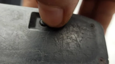 Macro Hand Pressing Vintage Camera Battery Cover Release Button Stock Footage 310176735